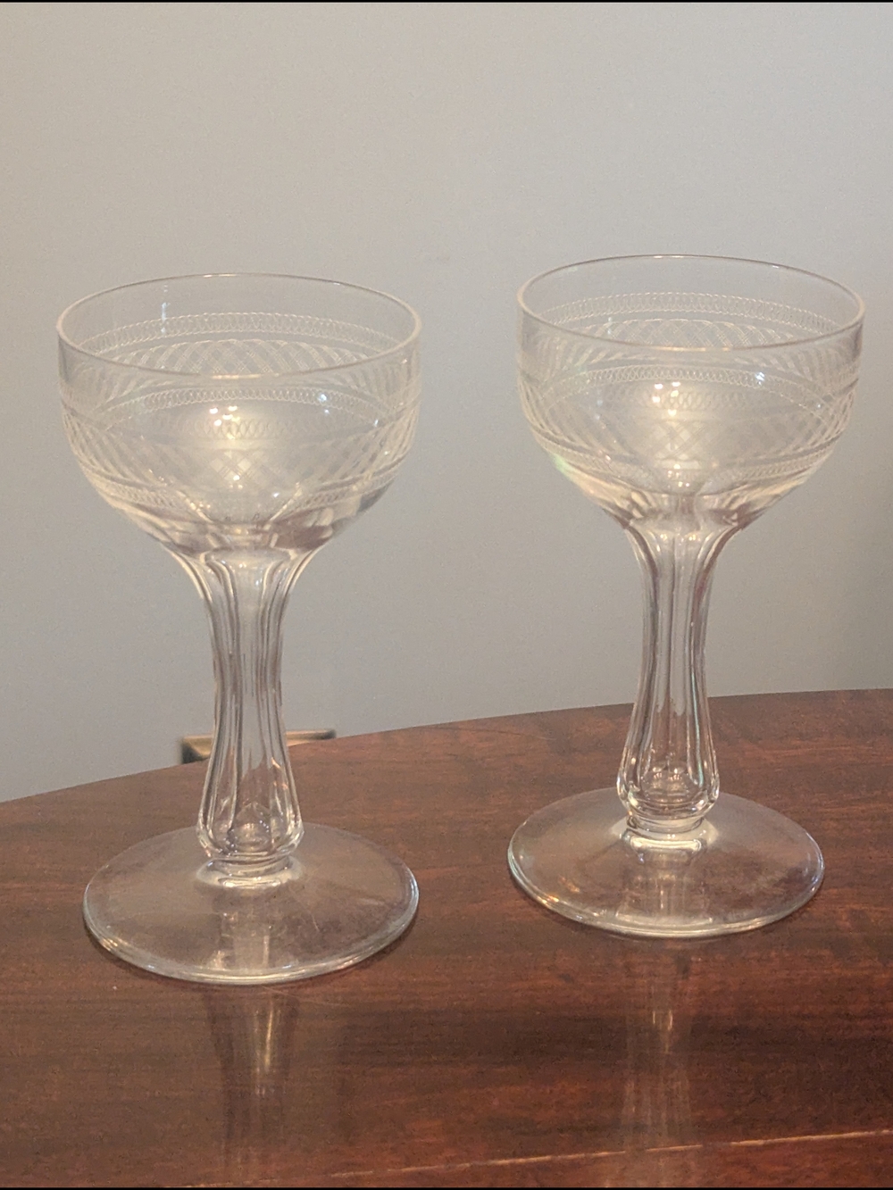 Two (2) Vintage Hollow Stem Etched Champagne Glass